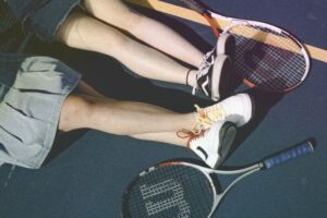 Can you play tennis in running shoes?